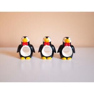 Set of 3 penguin napkin rings with little red bowties